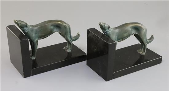 Constant Roux. A pair of bronze and black marble bookends, 7in. height 5.5in.